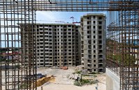 Эксперты объяснили, почему может затянуться передача квартир дольщикам - Недвижимость Строительство жилого комплекса в Сочи