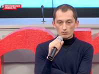 Фотографию Дмитрия Маркова "ОМОНовец под портретом Путина" продали с аукциона за 2 млн рублей Дмитрий Марков